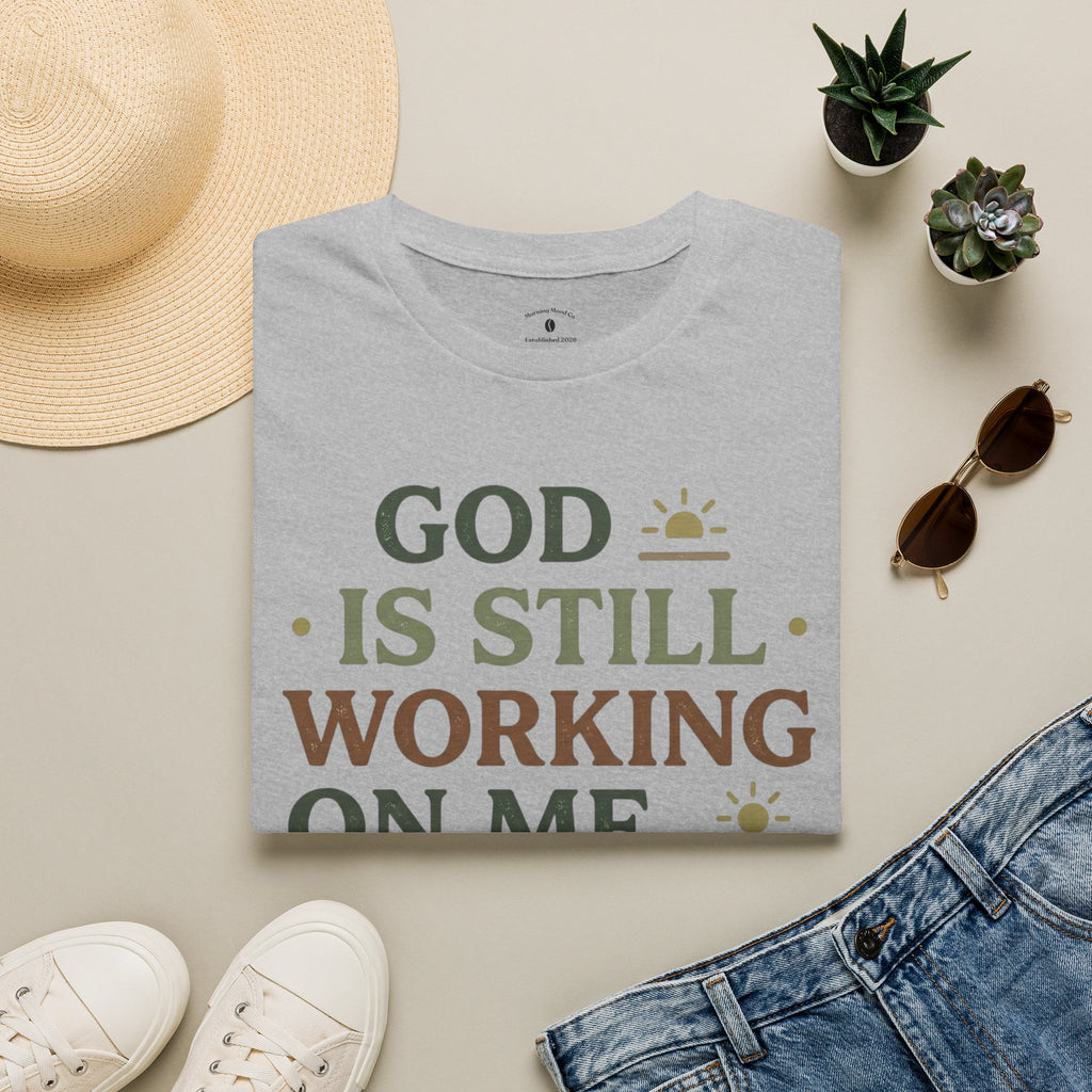 T-Shirt — "God Is Still Working On Me" Faith Graphic Tee